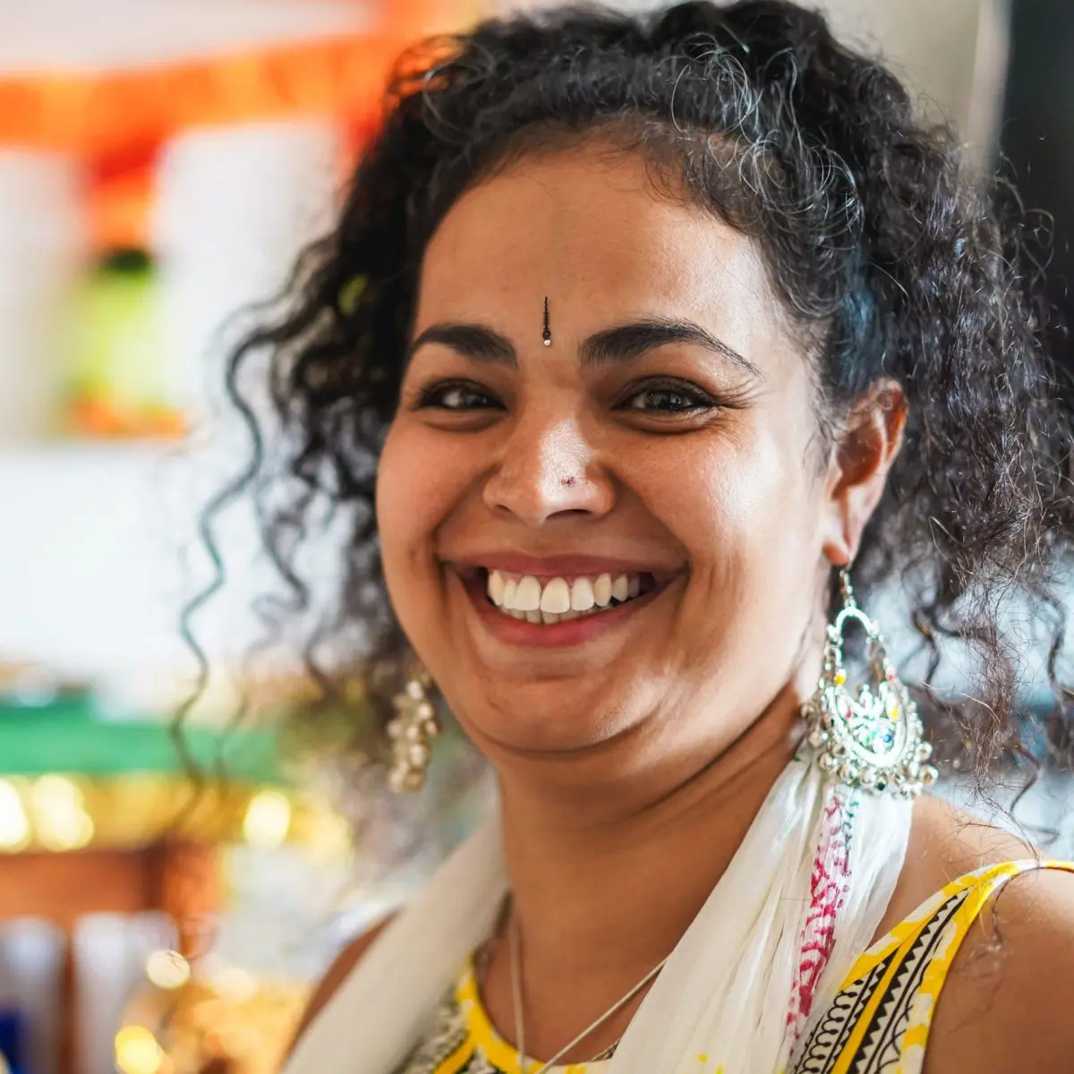 Close up of Woman smiling with Indian style jewellery