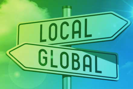 A sign with two arrows, one pointing to 'local' and the other pointing to 'global'