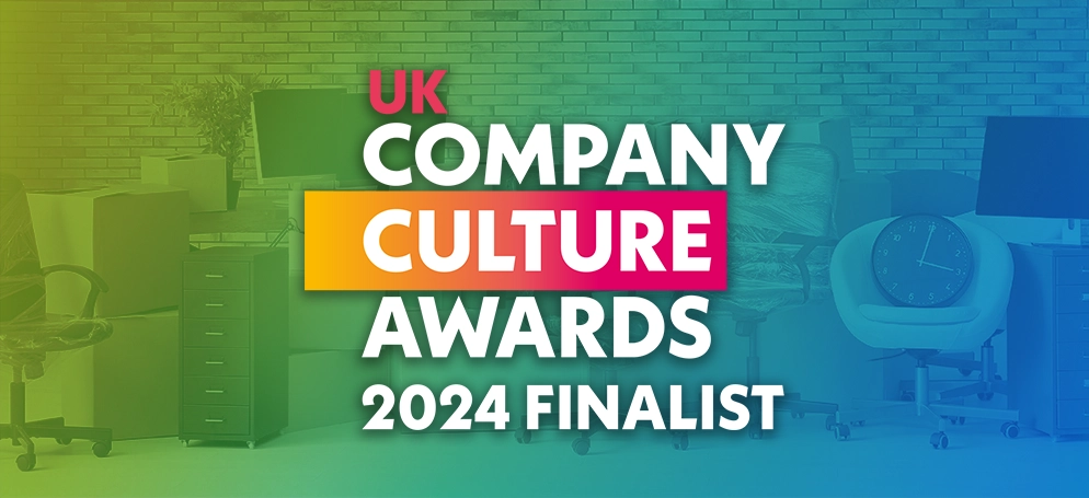 The logo for the UK Company Culture Awards with a collection of office furniture in the background