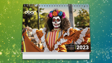 person in day of the dead costumewoman smiling