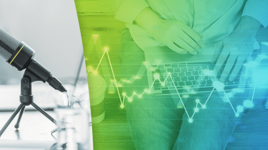 An image showing a recording microphone alongside someone typing on a laptop