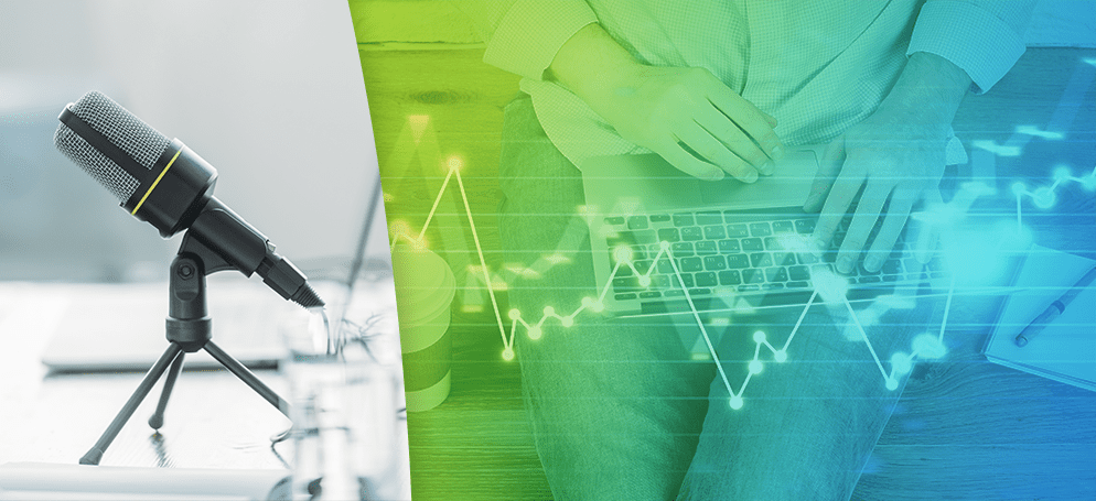 An image showing a recording microphone alongside someone typing on a laptop