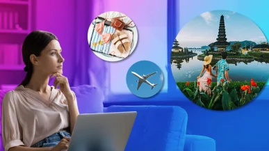 A young woman on a laptop daydreaming about travelling abroad