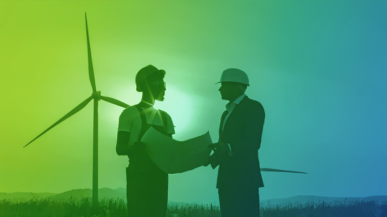 two people talking in front of wind turbine
