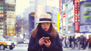 woman on phone in city