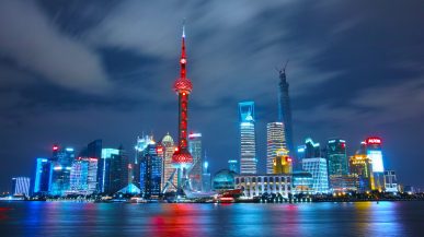 cityscape at night with river infront