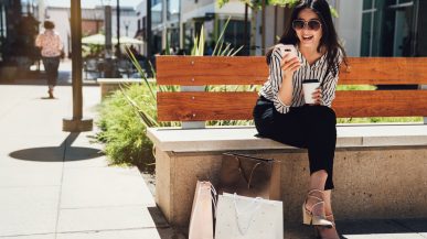 woman sitting on bench on sunny day