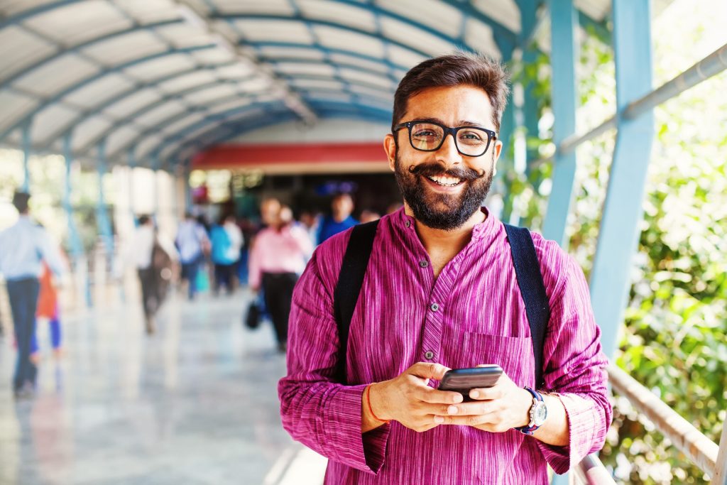 man smiling in public