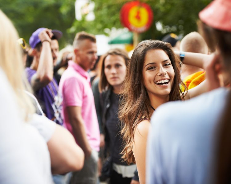 woman smiling in crowd