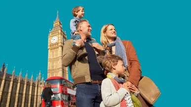 A tourist family in London with Big Ben in the background