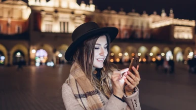 A Polish woman using her phone