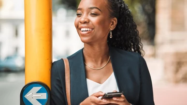 A South African woman using her phone in Cape Town