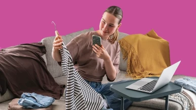 A woman photographing her clothes to sell online
