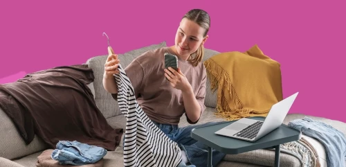 A woman photographing her clothes to sell online