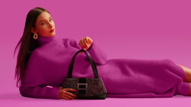 A model with a luxury handbag
