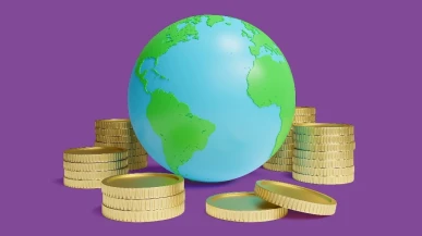A globe surrounded by coins
